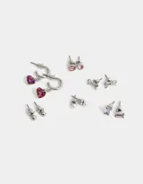 Set de seis pares de aros dorados con diferentes diseños: bolita metálica, perla, corazón, moño y strass.