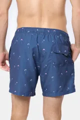 Short de baño clásico azul con estampado de palmeras, con cintura elástica y cordón regulable, dos bolsillos laterales y suspensor de malla fina.