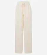 Pantalón recto de chiffon color crema con cintura elástica, lazo ajustable y textura de encaje.