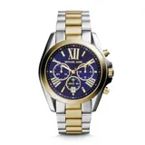 Reloj Michael Kors modelo Bradshaw con correa combinada plateada y dorada, caja plateada y esfera azul con números romanos dorados.