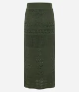 Pollera recta long midi color verde militar, con cintura elástica y confeccionada en tejido de punto con mix de puntos.