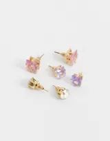 Set de tres pares de aros pasantes con strass en diferentes tonos y engarce dorado.