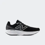 Championes de running New Balance modelo 520, color negro con entresuela blanca Fresh Foam. Presentan una capellada de malla transpirable y detalles sintéticos, diseñados para brindar amortiguación y ligereza durante la actividad física.