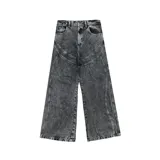 Pantalón de jean negro con efecto lavado, corte ultra baggy y diseño con paneles frontales.