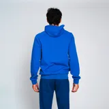 Canguro deportivo azul con capucha y bolsillo frontal, con escudo del Club Nacional de Football en el pecho y en el pantalón.