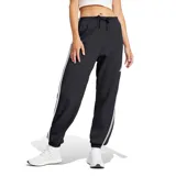 Pantalón deportivo Adidas Essentials French Terry Cuffed 3 Tiras para mujer, color negro con tres tiras blancas a los costados.