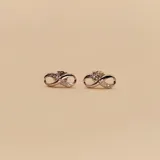 Par de aros de plata 925 con forma de infinito y circonias incrustadas.