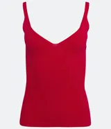 Blusa tipo musculosa de punto acanalado color fucsia, con escote en V y tirantes finos. Confeccionada con viscosa responsable y poliamida.
