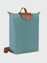 Mochila Longchamp modelo Le Pliage Original M, color crudo con detalles en cuero marrón.