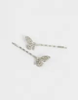 Set de dos horquillas plateadas para el pelo con forma de mariposa decorada con strass.