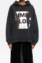 Sudadera oversize con capucha ajustable con cordones, de algodón color crudo con logo Bimba y Lola estampado en marrón. Manga larga con puños ajustados.