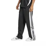 Pantalón deportivo Adidas Adibreak negro con rayas blancas laterales y botones a presión.