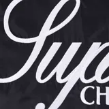 Campera negra con degradado a gris, de cuello alto y cierre frontal con cremallera. Presenta logos de Supreme y Umbro en el pecho, y detalles en gris en mangas y laterales.