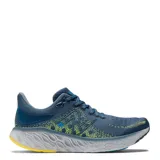 Championes de running New Balance Fresh Foam 1080 V12, color azul con detalles en amarillo y celeste.