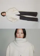 Chaqueta color crema de mezcla de lana con cuello alto y cierre de botones oculto.