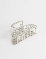 Broche dorado para el pelo con forma de media luna y apliques de strass.