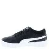 Championes Puma modelo Carina 2.0 para mujer, color blanco con franja lateral (Formstrip) negra. Presentan una plataforma gruesa con textura acanalada en la puntera y el talón, y cordones blancos.