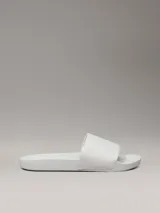 Chancletas Calvin Klein blancas con logo de la marca estampado en jacquard en la tira.