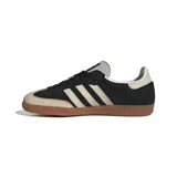 Championes Adidas Samba OG, color negro con detalles en beige y suela de goma marrón.