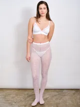Medias de lycra blancas con diseño de encaje floral.