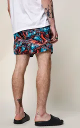 Short de baño de microfibra con estampado de caballos en tonos azul y naranja.