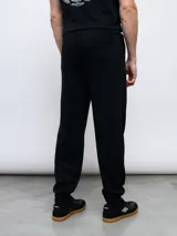 Pantalón de jogging azul marino de felpa sin friza, con puños elásticos y logo de Umbro bordado en celeste.