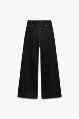 Pantalón de jean negro de tiro alto, corte wide leg y largo al tobillo.