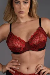 Soutien reductor con aro, de encaje rojo y negro. Breteles elásticos regulables y espalda reforzada con ganchos regulables.