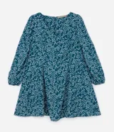 Vestido corto de crepé color verde azulado con estampado de mini corazones blancos, escote en pico, mangas largas con puños elásticos y cierre en la espalda.