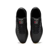 Championes Reebok Classic Leather negros de cuero con suela de goma color caramelo.