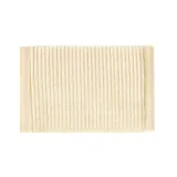 Billetera plegable color beige, confeccionada en tejido de pana acanalada. Presenta el logo de Rip Curl bordado en blanco en el centro.