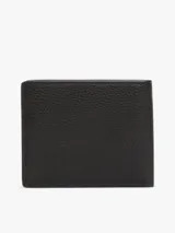 Billetera plegable Tommy Hilfiger de cuero granulado color negro, con logo metálico en la parte delantera y monogramas TH en relieve en el interior. Cuenta con múltiples ranuras interiores para tarjetas.