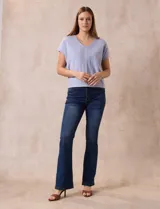 Buzo tejido color lila, marca Ninety. Escote en V. Calado en escote y delantera.