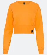 Sweater naranja de algodón, con cuello redondo, mangas largas y ribete elástico en la cintura.