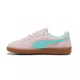 Championes Puma Palermo negros con detalles en blanco y suela color caramelo.