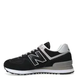 Championes unisex de la marca New Balance, con diseño deportivo en negro y gris, con cordones y suela de goma.