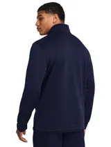 Buzo azul marino de Under Armour, modelo Storm Sweaterfleece, con cuello alto, cierre de cremallera hasta el pecho y logo bordado en el puño.