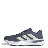 Championes Adidas Galaxy 7 color gris con detalles en blanco y las tres tiras características de la marca en color crema.