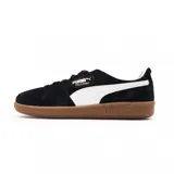 Championes Puma Palermo negros con detalles en blanco y suela color caramelo.