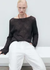 Pantalón de lino blanco, de corte recto y tiro alto, con cintura elástica ajustable con cordón.