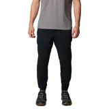 Pantalón de trekking negro con corte tapered, tejido resistente al agua y a las manchas, cintura elástica, bolsillos delanteros, bolsillo de seguridad, dobladillo elástico, entrepierna reforzada, pierna acampanada y bolsillo trasero con botón de presión.