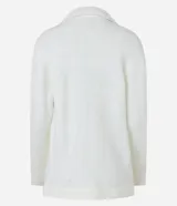 Cardigan alargado color blanco, con cuello virada, forro de pelos y confeccionado en punto pesado. No tiene cierre.