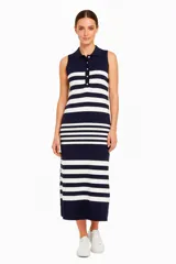Vestido midi sin mangas, a rayas horizontales azul marino y blancas, con cuello camisero y botones frontales.