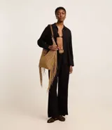 Pantalón wide leg negro de viscolino, con tiro alto, trabillas en la cintura, cierre tradicional y pliegues.
