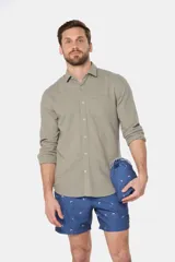 Short de baño clásico azul con estampado de palmeras, con cintura elástica y cordón regulable, dos bolsillos laterales y suspensor de malla fina.