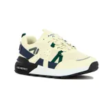Zapatilla deportiva de estilo chunky, color crema/hueso, con detalles en azul marino y verde oscuro. Presenta malla transpirable, cordones bicolores y suela gruesa con tecnología MAX-PROTECT.