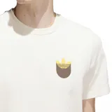 Remera Adidas color crema con logo Trefoil estampado en el pecho en tonos marrón y dorado.