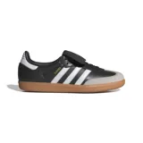 Championes Adidas Samba LT de cuero negro con las tres tiras blancas, puntera de gamuza gris y suela de goma marrón.