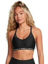 Top deportivo negro Under Armour con breteles cruzados en la espalda y banda elástica con el logo de la marca.