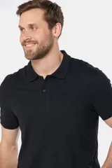 Remera polo negra de jersey de algodón con logo bordado en el pecho y botones personalizados.